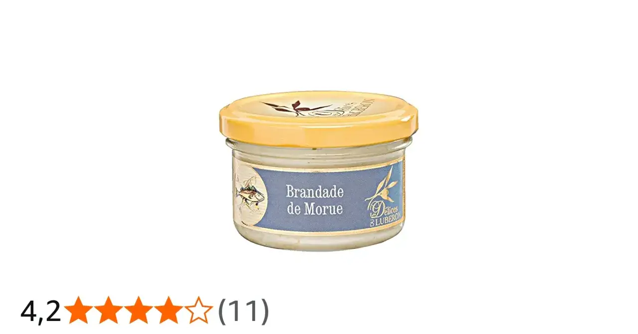 Glas mit Brandade de Morue, einer cremigen Kabeljaupaste, mit einem Fischmotiv und Olivenzweig auf dem Etikett.